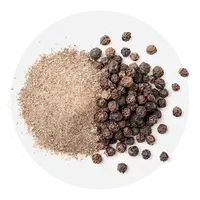 Black pepper and ground black pepper on a white plate