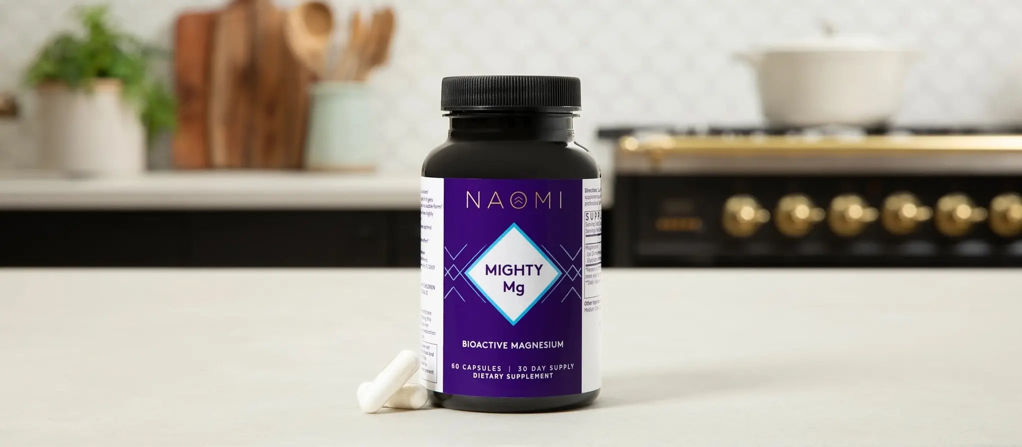NAOMI Mighty Mg supplement bottle on a kitchen counter