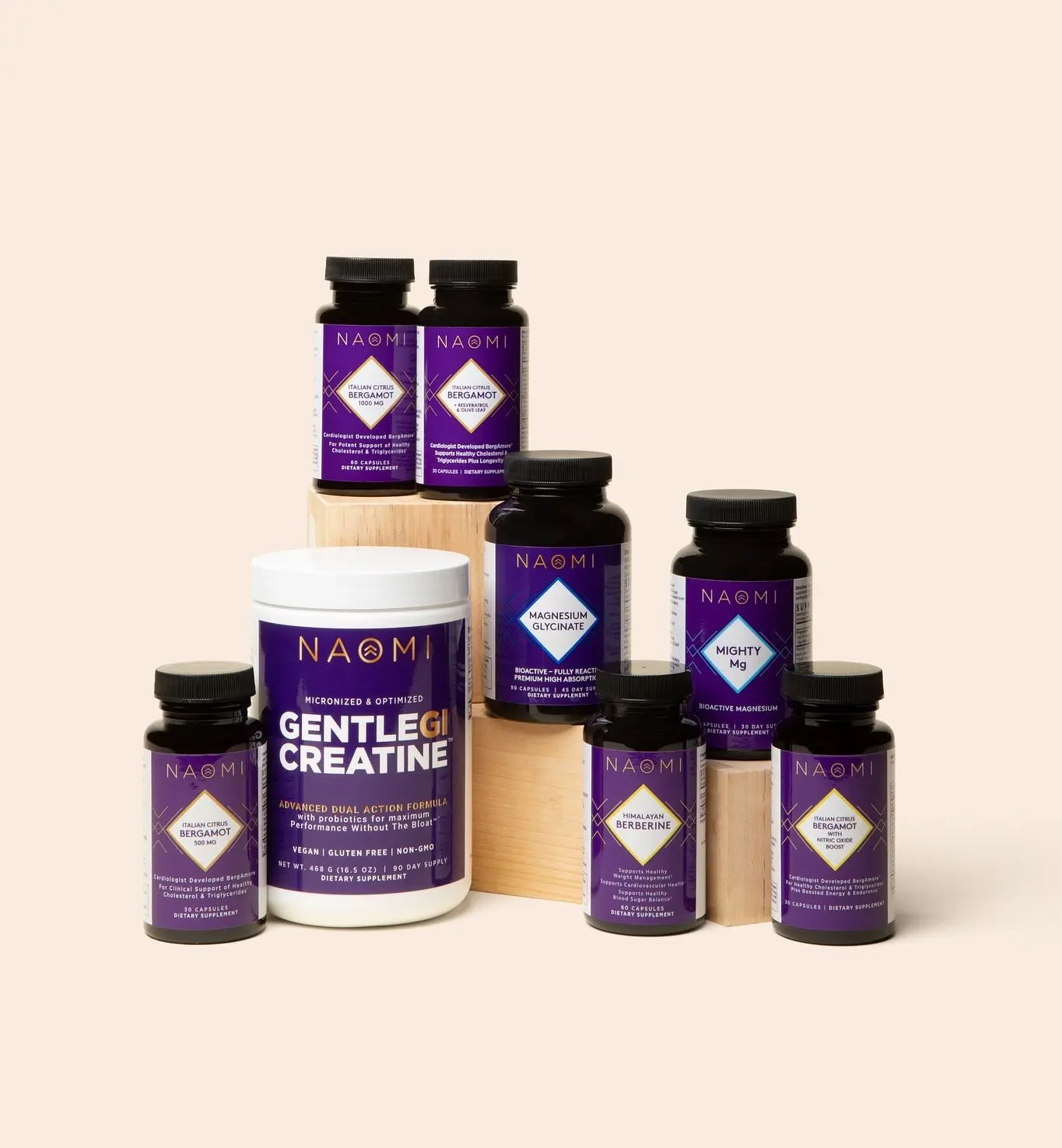 Collection of Naomi supplement bottles and containers on a beige background