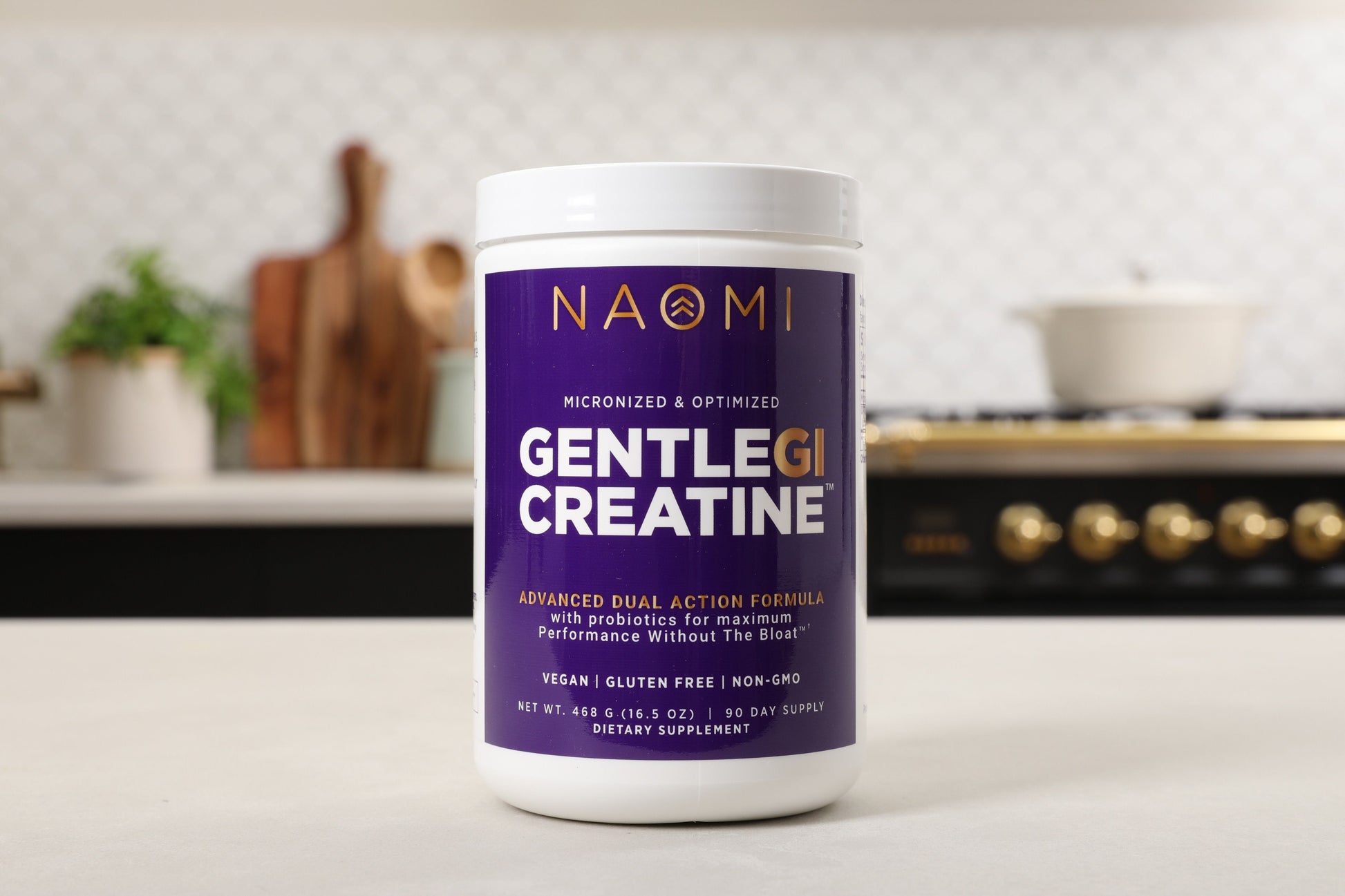 Container of Naomi Gentle GI Creatine on a kitchen counter