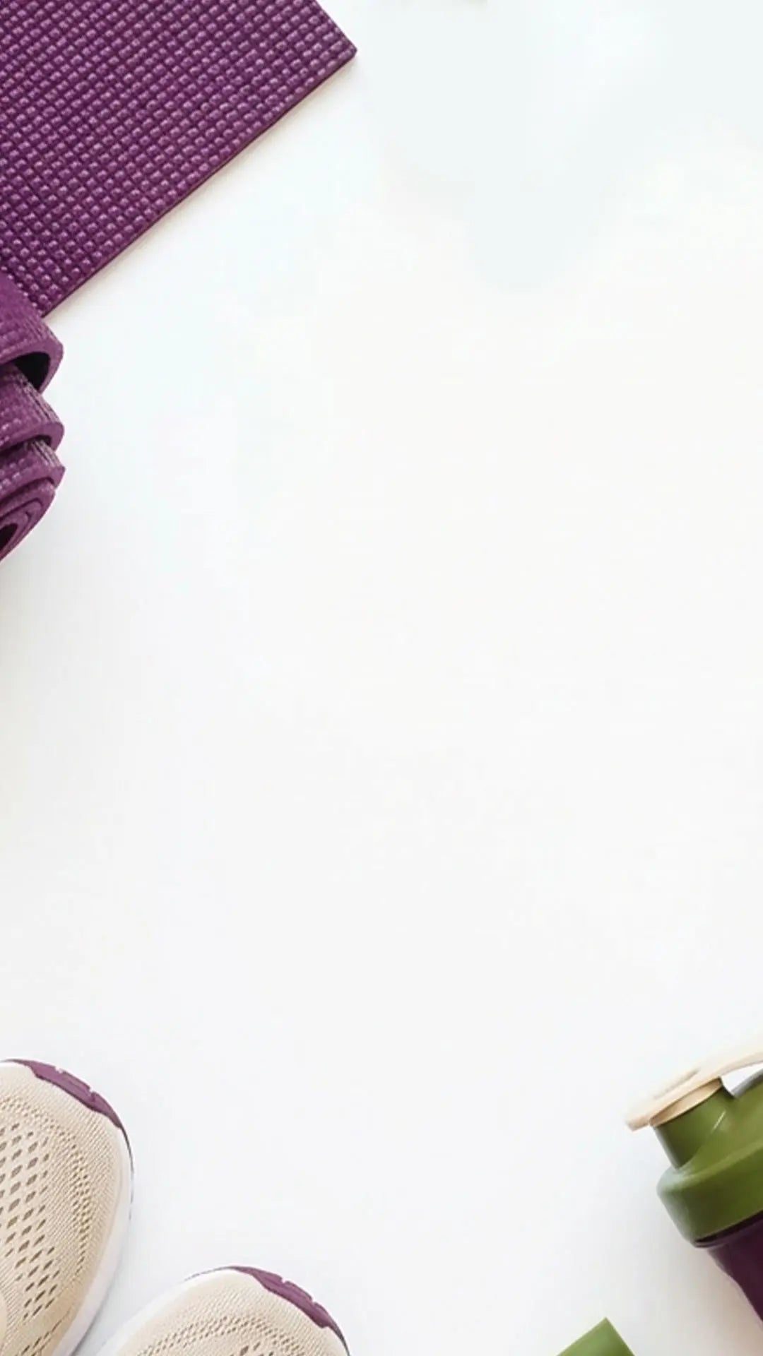 Purple yoga mat, white sneakers, and green water bottle on a white surface